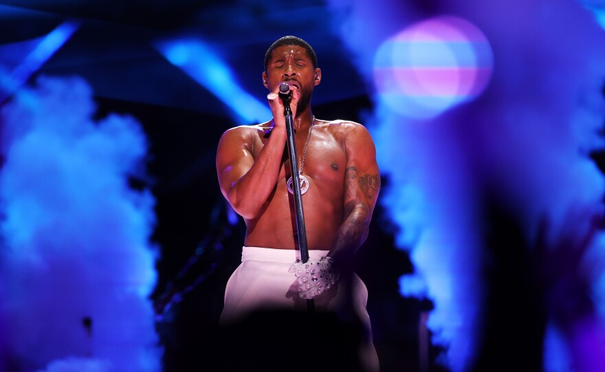 Usher performs onstage during the Apple Music Super Bowl LVIII Halftime Show at Allegiant Stadium in Las Vegas, Nevada.