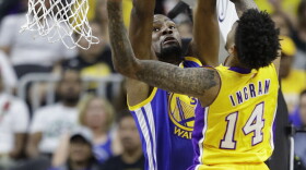 Golden State Warriors' Kevin Durant blocks Los Angeles Lakers' Brandon Ingram during the first half of an NBA preseason basketball game in Las Vegas, Oct. 15, 2016.