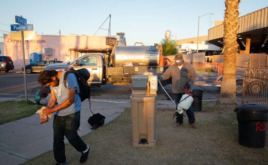 A man walks away from a hand-washing station in Calexico's Border Friendship Park, April 21, 2020. The portable stations are brought to the park every evening during the Brown Bag Coalition's dinner handouts.