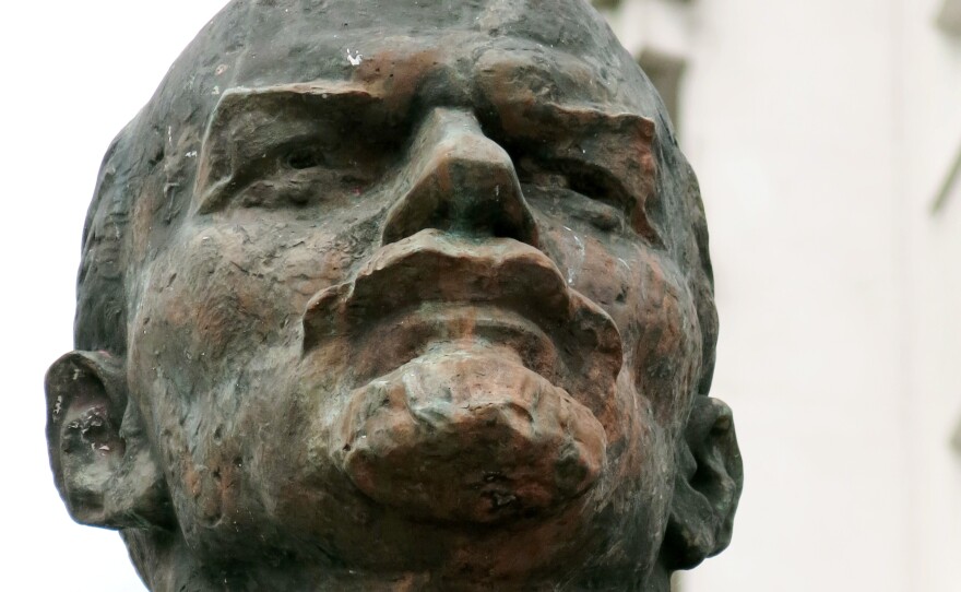 A detail of the Lenin statue in Schwerin, Germany.  Someone recently wrote on the pavement beneath the statue in red paint, "Lenin stays," in protest against people who want it removed.