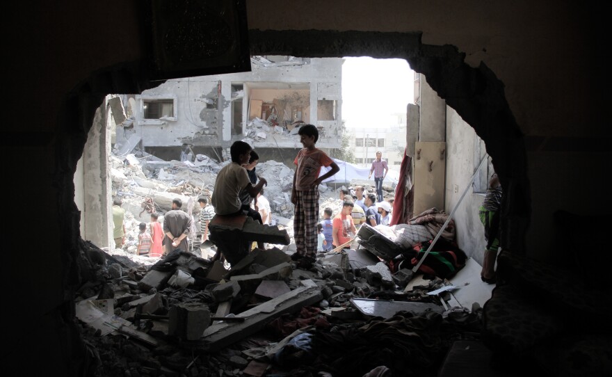 Palestinian boys at a damaged building in Rafah, the Gaza Strip, on Thursday. U.S. attempts to broker a comprehensive peace deal have again been shelved as Israel and Hamas have waged their third round of heavy fighting in Gaza in the past six years.