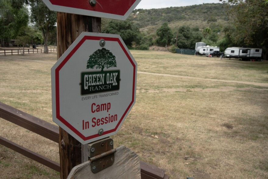 A sign on the road in Green Oaks Ranch warns of camp in session on June 10, 2024, in Vista, Calif. The property often hosts retreats for foster youth and other vulnerable populations.
