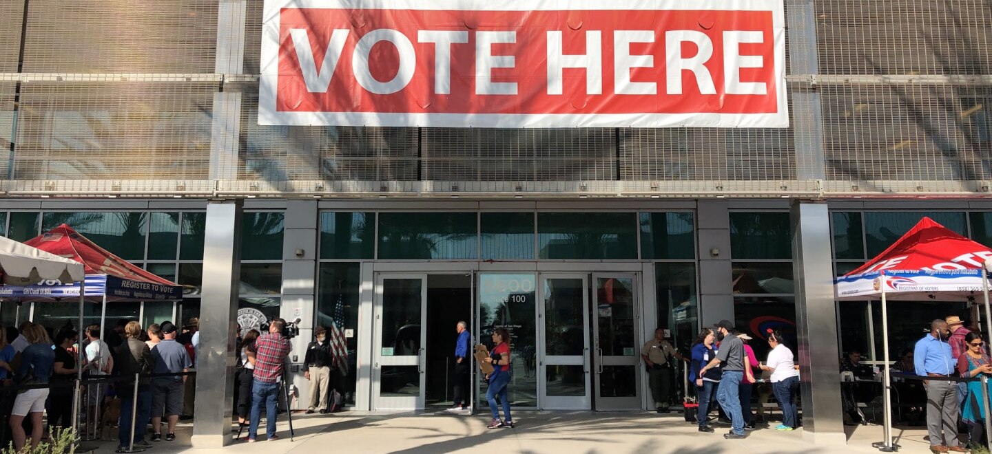 A "Vote Here" sign hangs on the San Diego County Registrar Of Voters Office, Nov. 6, 2018.