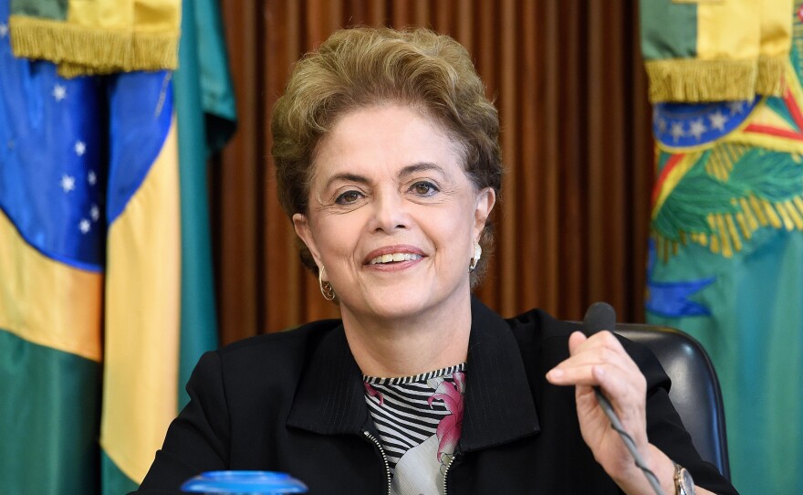 Brazilian President Dilma Rousseff, shown here at a meeting with rectors of public universities in Brasilia on March 11, is facing impeachment proceedings over her handling of the economy.