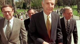 Former California Gov. George Deukmejian, center, and his successor, Pete Wilson, right, leave a news conference at the Capitol in Sacramento Thursday, March 21, 1996.