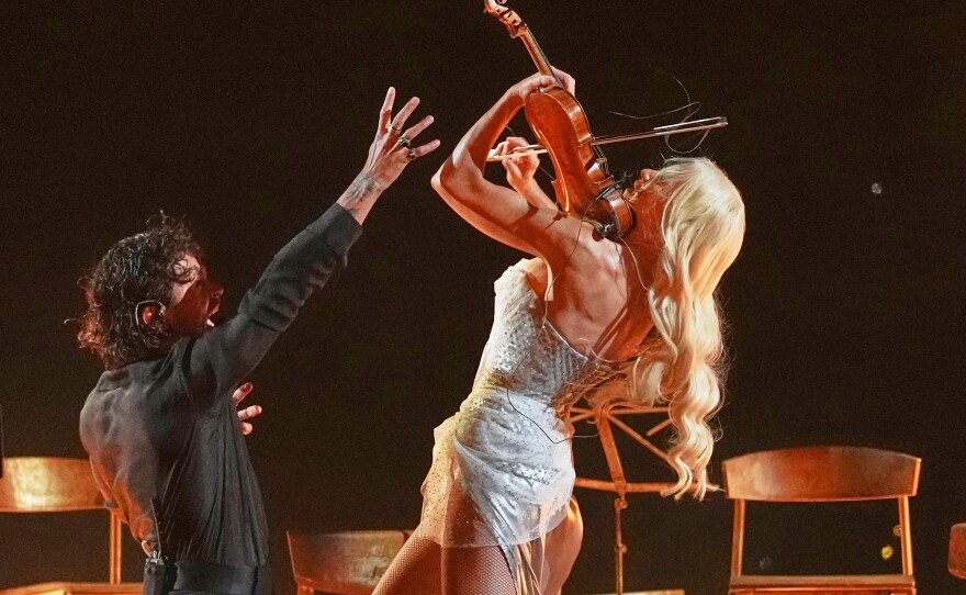 Linda Lampenius and Pete Parkkonen from Finland perform the song "Liekinheitin" during the first semifinal of the 70th Eurovision Song Contest in Vienna, Austria, Tuesday, May 12, 2026.