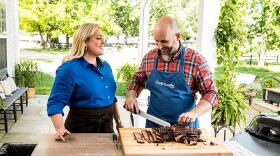 Test cook Bryan Roof (right) makes host Julia Collin Davison (left) a tender and delicious Texas Barbecue Brisket. 