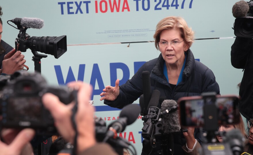 Sen. Elizabeth Warren speaks to reporters in Des Moines, Iowa, on Friday, after releasing her plan to pay for single-payer health care.
