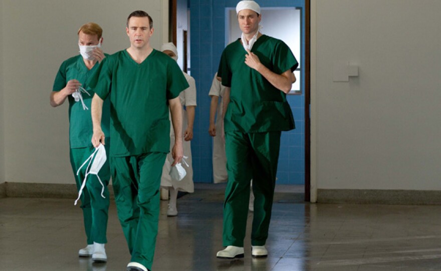 Shaun Dingwall as Dr. Charlie Enderbury, Jack Davenport as Dr. Otto Powell and Oliver Chris as Dr. Richard Truscott.