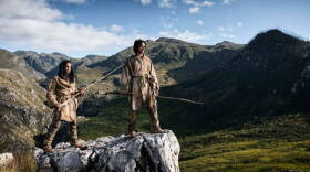 First Americans survey landscape.