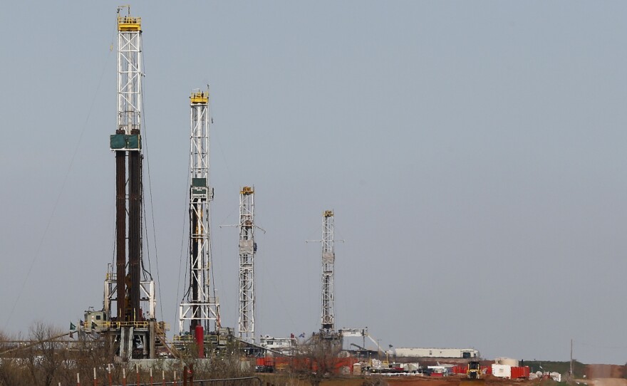 Drilling rigs dot the landscape near Calumet, Okla., in April 2013. Oklahoma's economy blossomed during the domestic fracking boom, but as the price of crude oil drops, that could change.