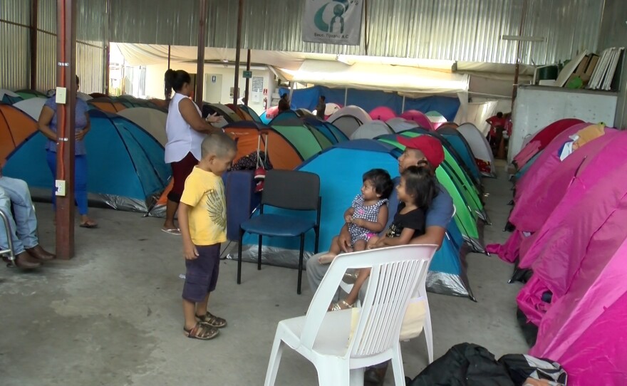 Asylum-seekers rest in tents in Tijuana, April 24, 2018.