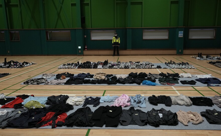 Clothes collected from the scene of a deadly accident following Saturday night's Halloween festivities are placed at a temporary lost and found center at a gym in Seoul.
