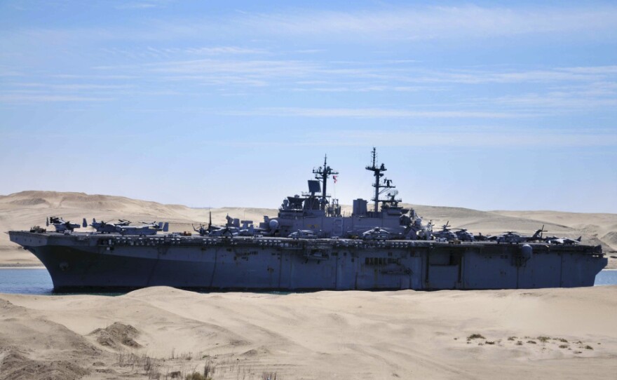 The amphibious assault ship USS Kearsarge traveled through the Suez Canal in Ismailia, Egypt, on Wednesday on its way to the Mediterranean.