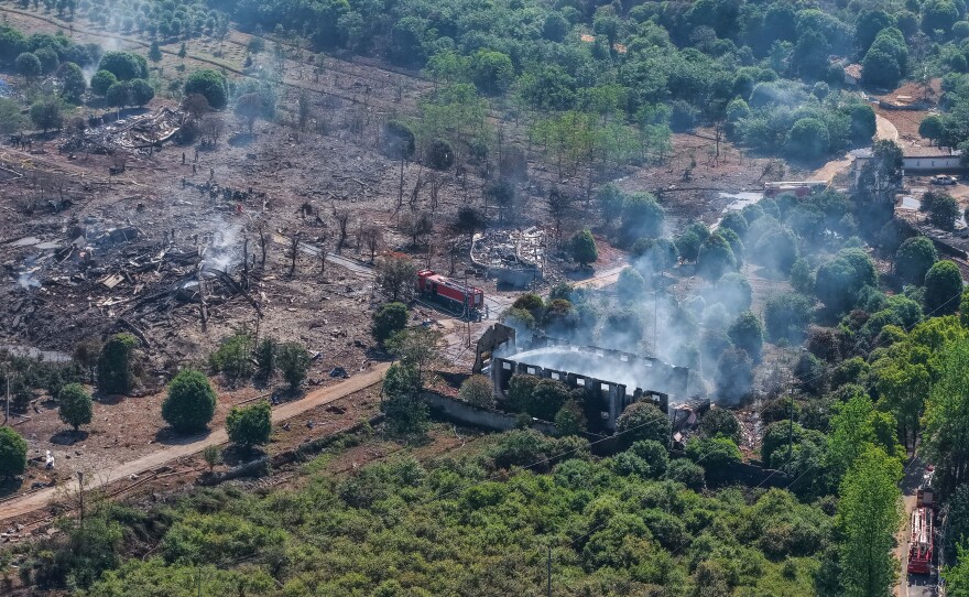 This photo released by Xinhua News Agency, this aerial drone photo taken May 5, 2026 shows rescuers working on site after an explosion at a fireworks plant in Guandu Town of Liuyang, central China's Hunan Province.