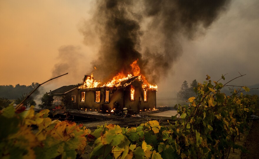 The Kincade Fire burns through the Jimtown community of Sonoma County, Calif., on Thursday.