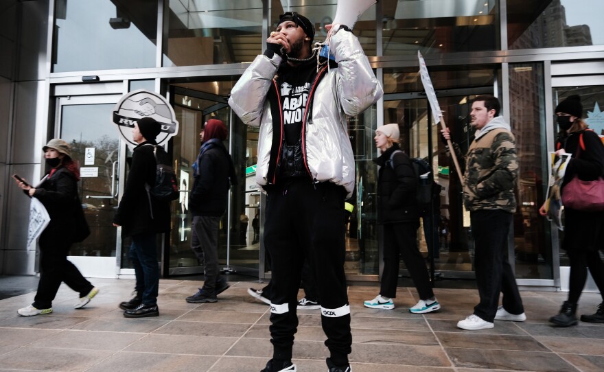 Amazon Labor Union President Chris Smalls speaks at a protest outside of a New York event featuring Amazon CEO Andy Jassy. The independent ALU won a union election at a warehouse in Staten Island in April, but has been unable to win other union elections.