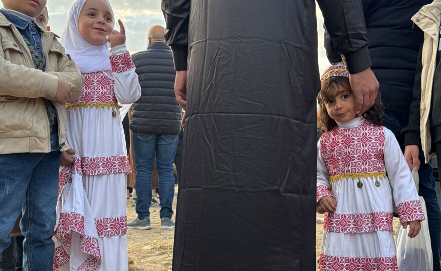 Children wore colorful new clothes for Eid.