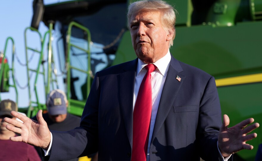 Former President Donald Trump speaks to reporters during a visit to a family farm in Leighton, Iowa, on Oct. 1, 2023.