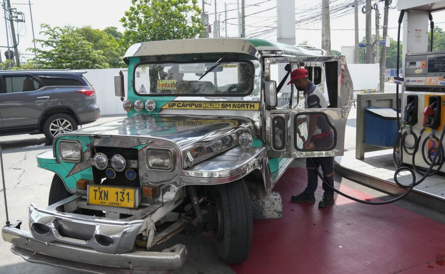 A passenger jeepney driver refuels his vehicle at a gasoline station in Quezon City, Philippines on Monday, June 20, 2022.