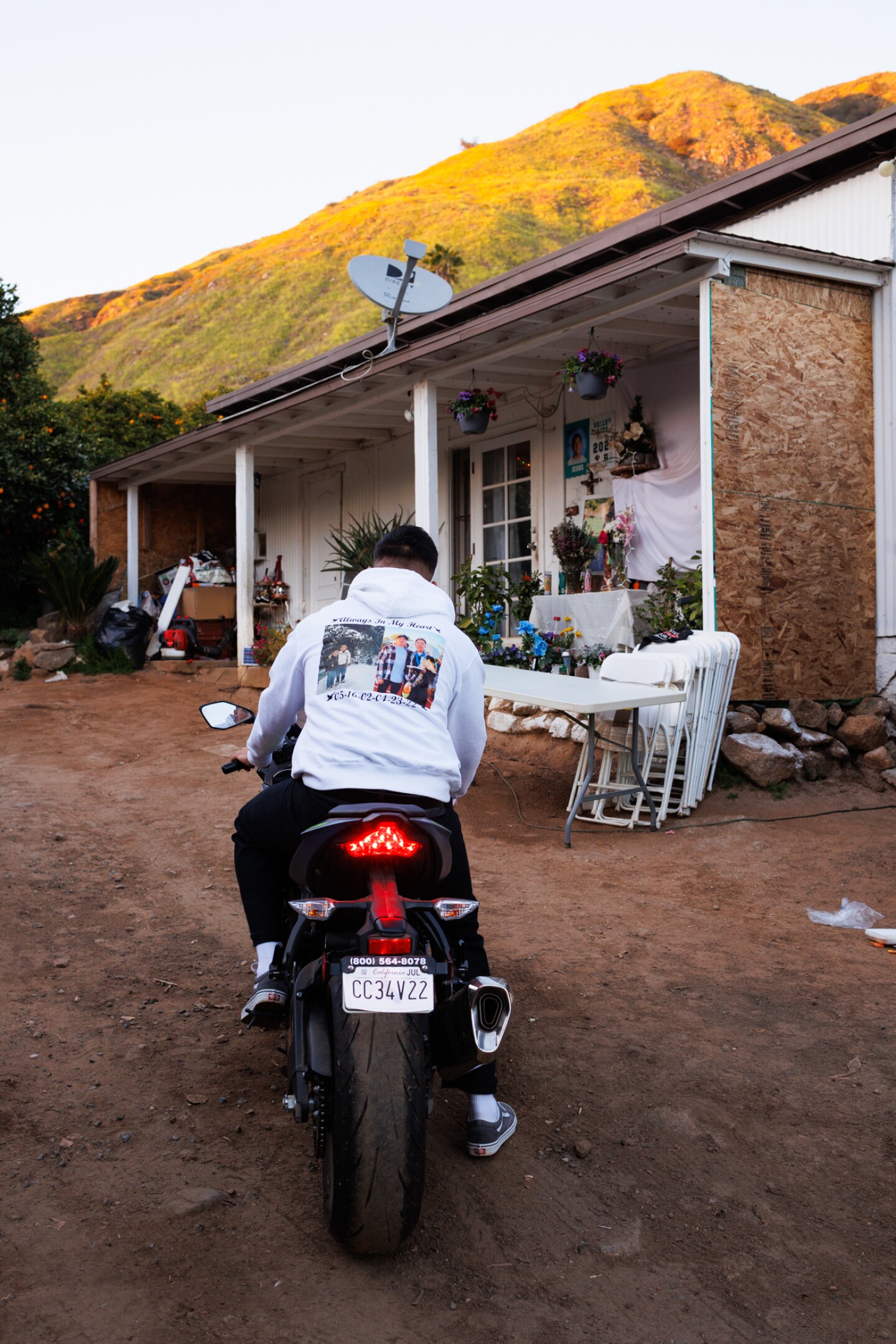 Jose Saldaña Rocha is photographed on his brother's motorcycle, Feb. 20, 2023.