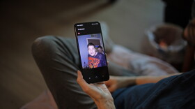 Debbie Willson holds a photo of her son, Adam Willson, who died in June 2024. Debbie is sure his death was influenced by heat, but his death certificate doesn't mention it. Such omissions are common nationwide and result in an undercount of the impact of heat, an investigation from NPR and Boston University finds.