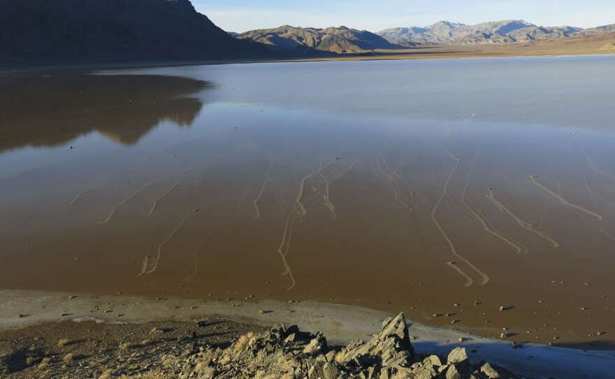 View of the partly flooded Racetrack shortly after the Dec. 20, 2013, event in which hundreds of rocks carved trails in the mud as they were pushed along by floating ice.