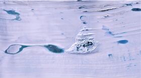 A huge lake of melted water collapses on the Amery ice shelf in the Antarctica in this undated photo 