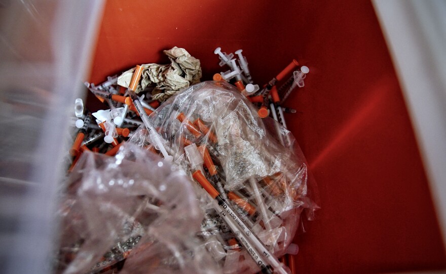 Used syringes, collected by the staff of the Family and Medical Counseling Service Inc. (FMCS), are seen in a container inside the FMCS van in Washington, D.C., on April 21. Several organizations in the U.S. capital are trying to fight the harm caused by fentanyl, an ultra-powerful and addictive synthetic opioid. In 2021, 95 percent of the city's fatal opioid overdoses were fentanyl-related.