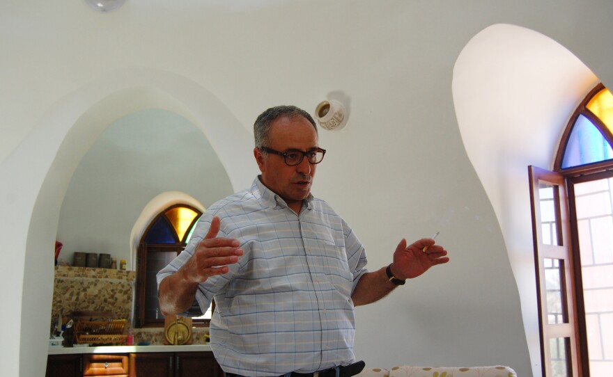 Ahmad Daoud's neighbors in Jericho are skeptical of his home, with its walls packed with earth and domed ceilings.