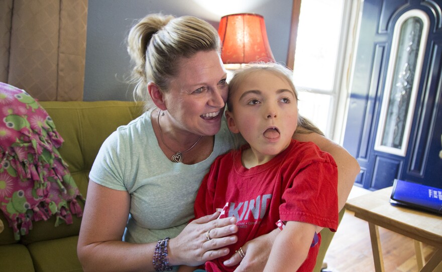 Brenda Hummel and her 7-year-old daughter Andrea in their home near Des Moines, Iowa. Andrea was born with severe epilepsy and gets her health care through Medicaid.