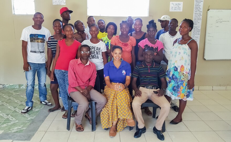 Stefani McCoy, seated in the center of the front row, was a high school dropout. After going back to school and completing her college degree, she joined the Peace Corps and went to Namibia to help fellow dropouts.