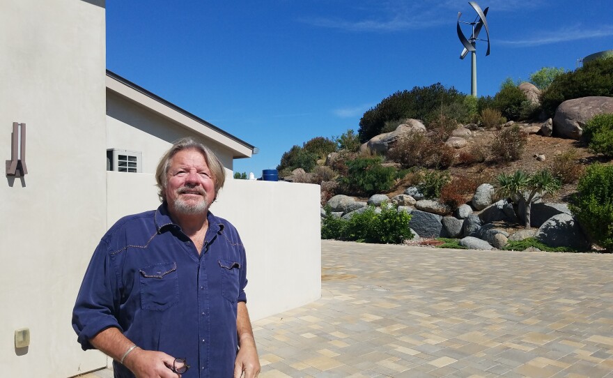 Pete Beauregard stands outside the Ramona home he shares with his wife Amy McQuillan, Aug. 26, 2019.