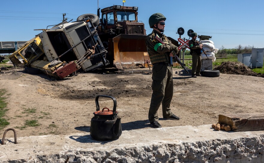 Ukrainian national guard soldiers stand watch near front-line positions on May 7 in Zelenodolsk, Ukraine. The area is on the northern edge of the Kherson region, much of which came under Russian control early in the war.