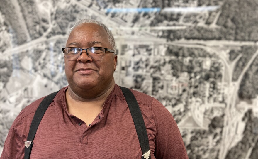 York Mayor Willie Lake stands in front of an aerial photograph of York.
