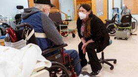 Amanda Eldridge, a certified occupational therapist assistant, works with a veteran at the state-run St. James Veterans Home in St. James, Missouri.