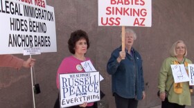 Supporters of tough Arizona immigration laws outside the state capitol.
