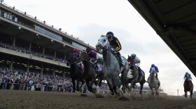 Joel Rosario rides Knicks Go, foreground, to victory during the Breeders' Cup Classic race at the Del Mar racetrack in Del Mar, Calif., Saturday, Nov. 6, 2021.