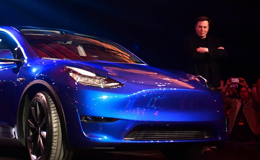 Tesla shareholders say CEO Elon Musk, pictured here unveiling the Model Y in Hawthorne, Calif., in 2019, brought undue financial risk to the company by tweeting about a possible buyout.