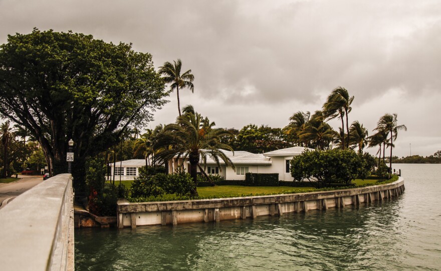 Diane Walder and her husband have raised their sea wall and renovated their home to protect against stronger hurricanes and rising sea levels.