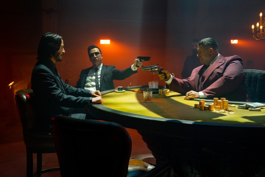Keanu Reeves as John Wick, Donnie Yen as Caine, and Scott Adkins as Killa in "John Wick: Chapter 4."