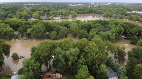 This aerial photo provided by the Indianapolis Fire Department shows flooding in northern Indianapolis, Ind., Saturday, Aug. 15, 2026.