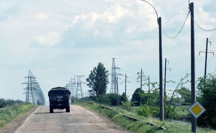 A Russian military truck painted with the letter Z moves on a road in the Kherson region on May 19. Russia seized areas in the region in the weeks after launching its invasion of Ukraine in late February.