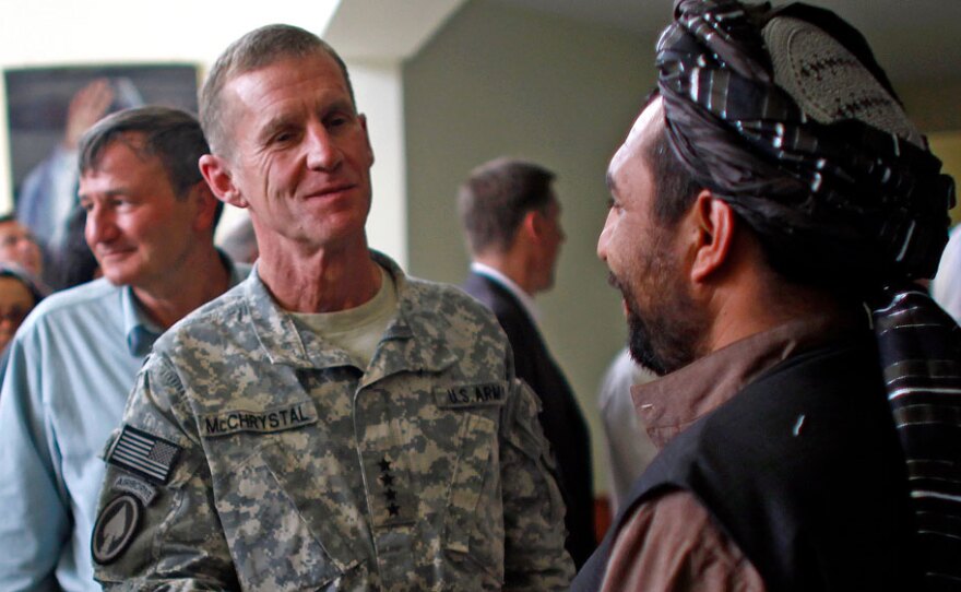 U.S. Army Gen. Stanley McChrystal and U.S. Ambassador to Afghanistan Karl Eikenberry (left) meet with local Afghan officials at a conference Monday in Kandahar, Afghanistan.