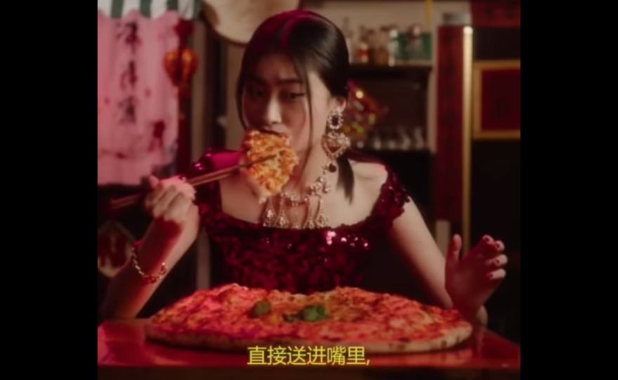Dolce & Gabbana released a set of video ads, featuring a model using chopsticks and struggling to eat different types of Italian food.