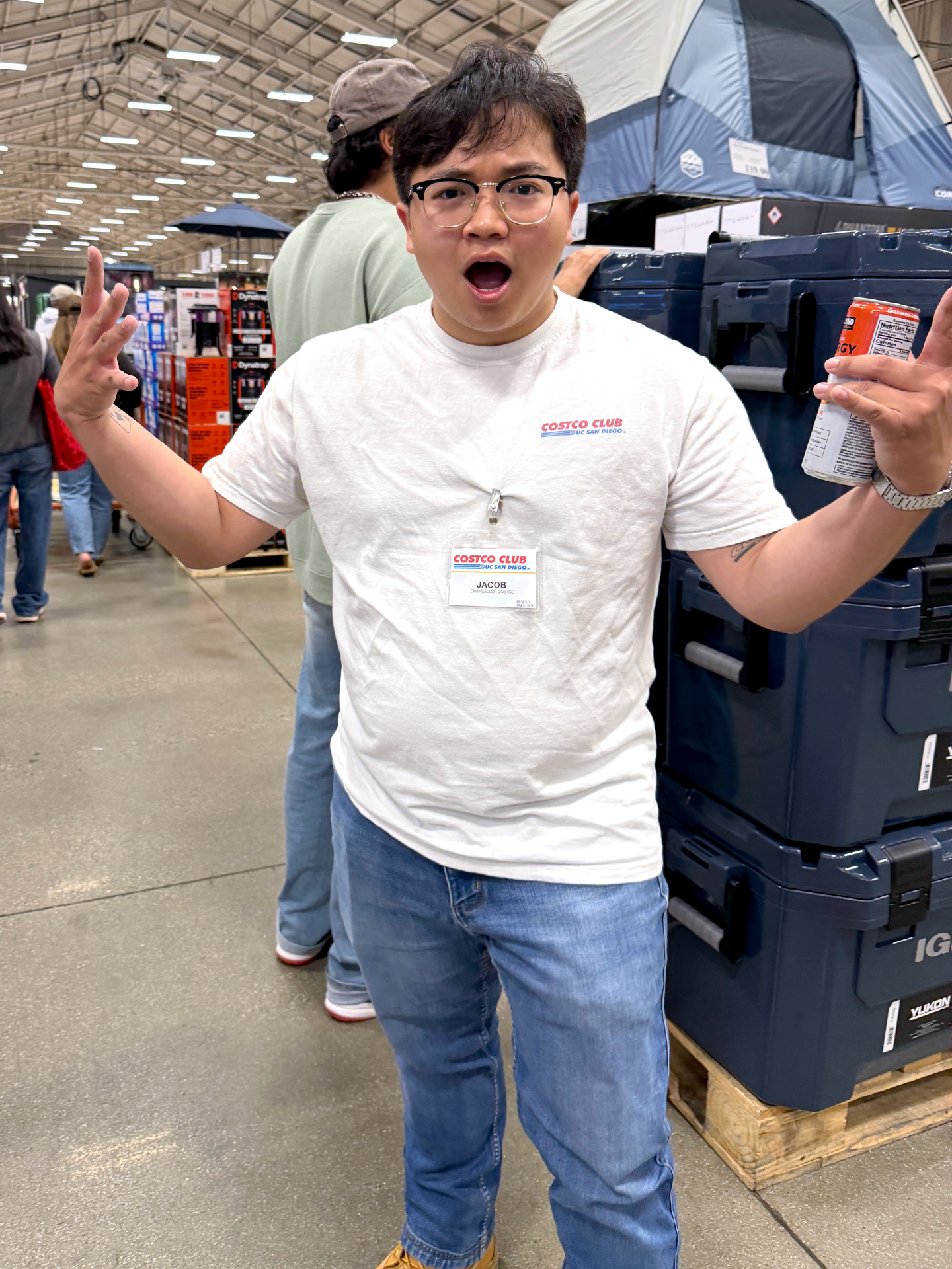 Jacob Hoang, outgoing president of the UCSD Costco Club, stands inside Costco holding a Kirkland Signature energy drink on May 31, 2026.