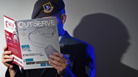 A gay member of the U.S. Air Force who wishes not to be identified reads a copy of the new magazine <em>OutServe</em> intended for actively serving lesbian, gay, bisexual and transgender U.S. military members earlier this month.