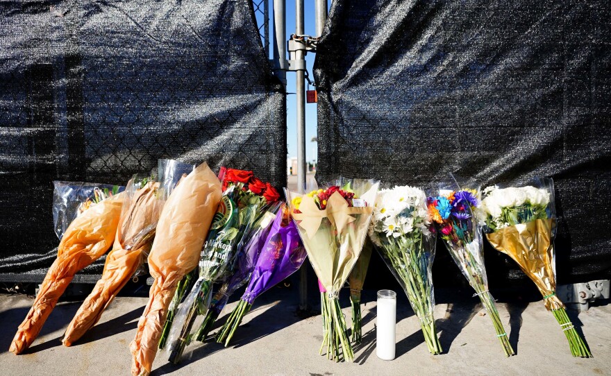 Flowers rest outside of the canceled Astroworld festival at NRG Park in Houston, Texas on Saturday. The crowd surge that killed eight people calls to mind other concerts and music festivals that turned deadly in recent decades.