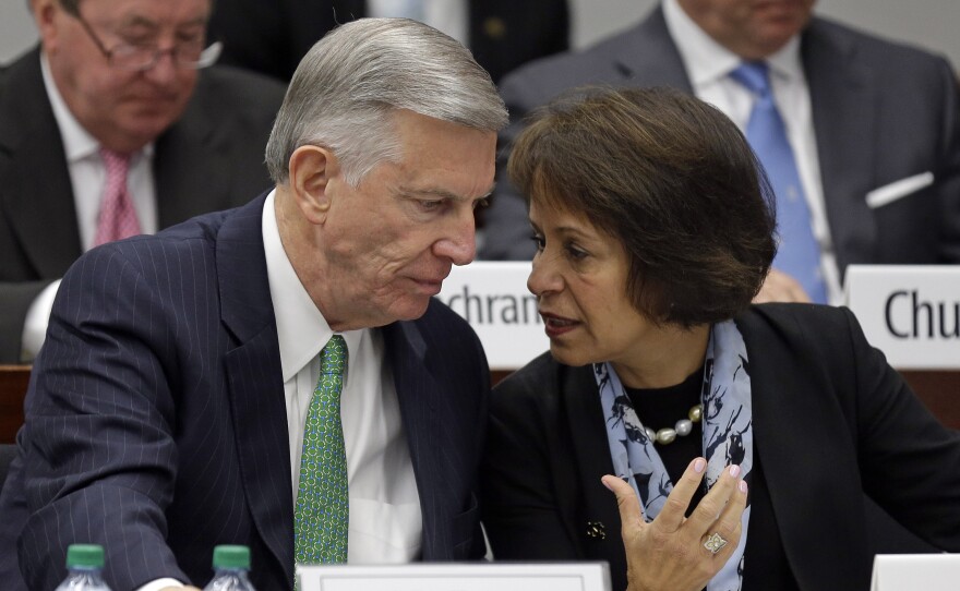 University of North Carolina system President Tom Ross and UNC-Chapel Hill Chancellor Carol Folt talk during a special joint meeting of the UNC Board of Governors and the UNC-Chapel Hill Board of Trustees on Wednesday.
