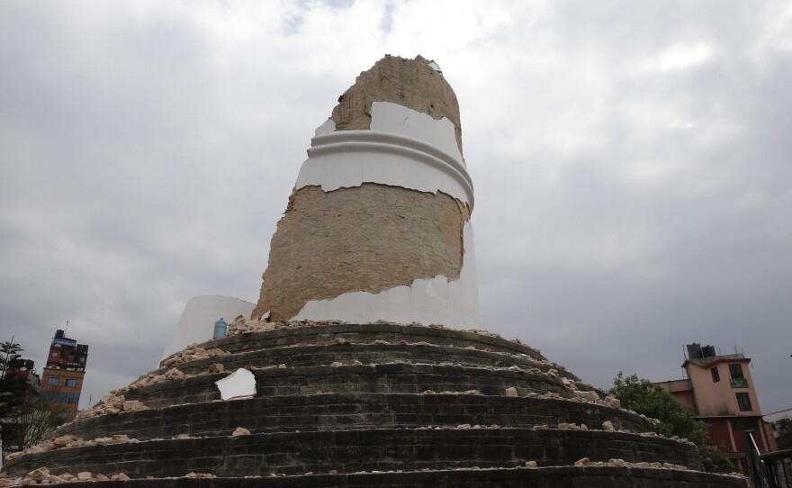 (Top) Bhimsen Tower, also called Dharahara, is seen in Kathmandu on July 27, 2013. (Bottom) The collapsed landmark on Saturday.